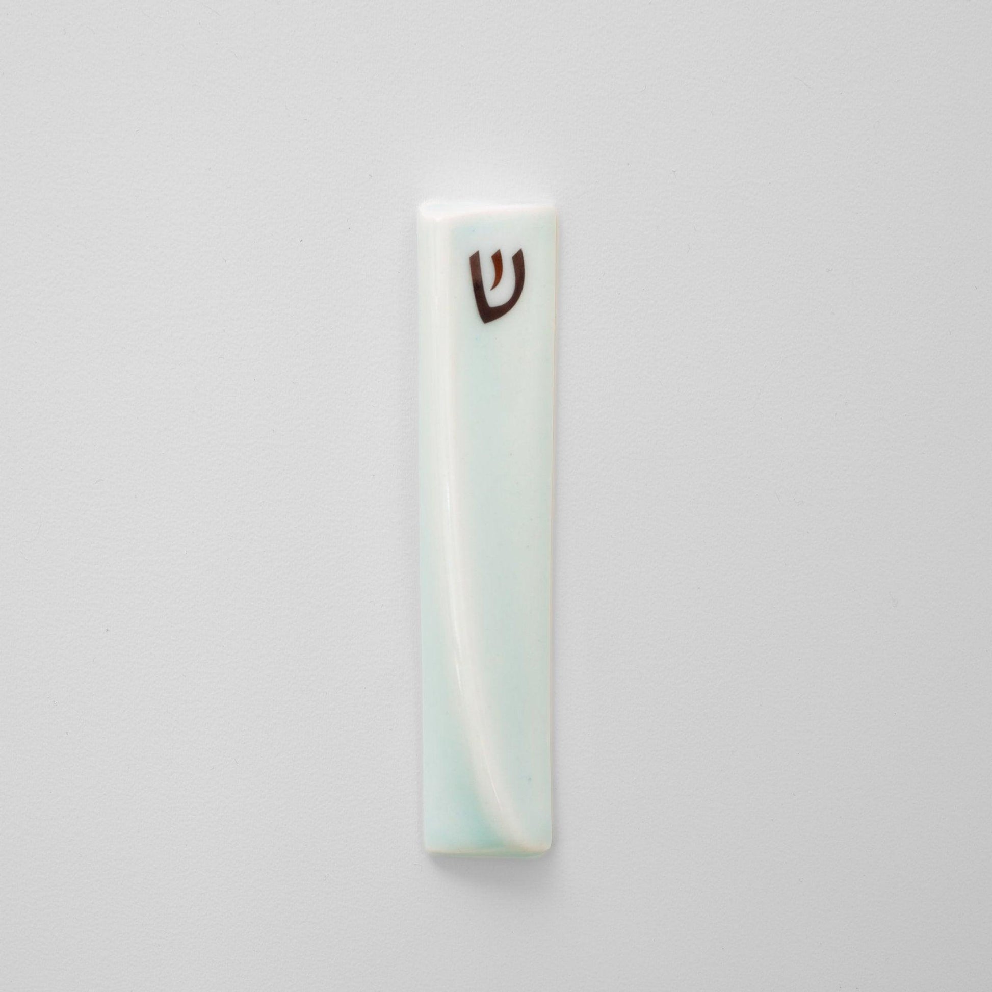 Handcrafted mezuzah with a sleek, modern design, featuring minimalist details and a smooth finish, perfect for adorning doorposts with style and tradition. Available at Green Judaica.