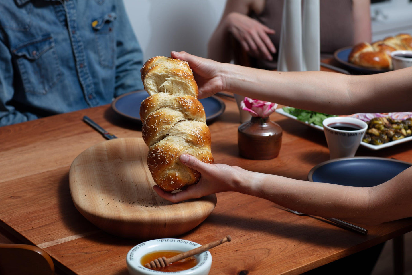 Handmade wooden tray being used for Challah at Shabbat dinner