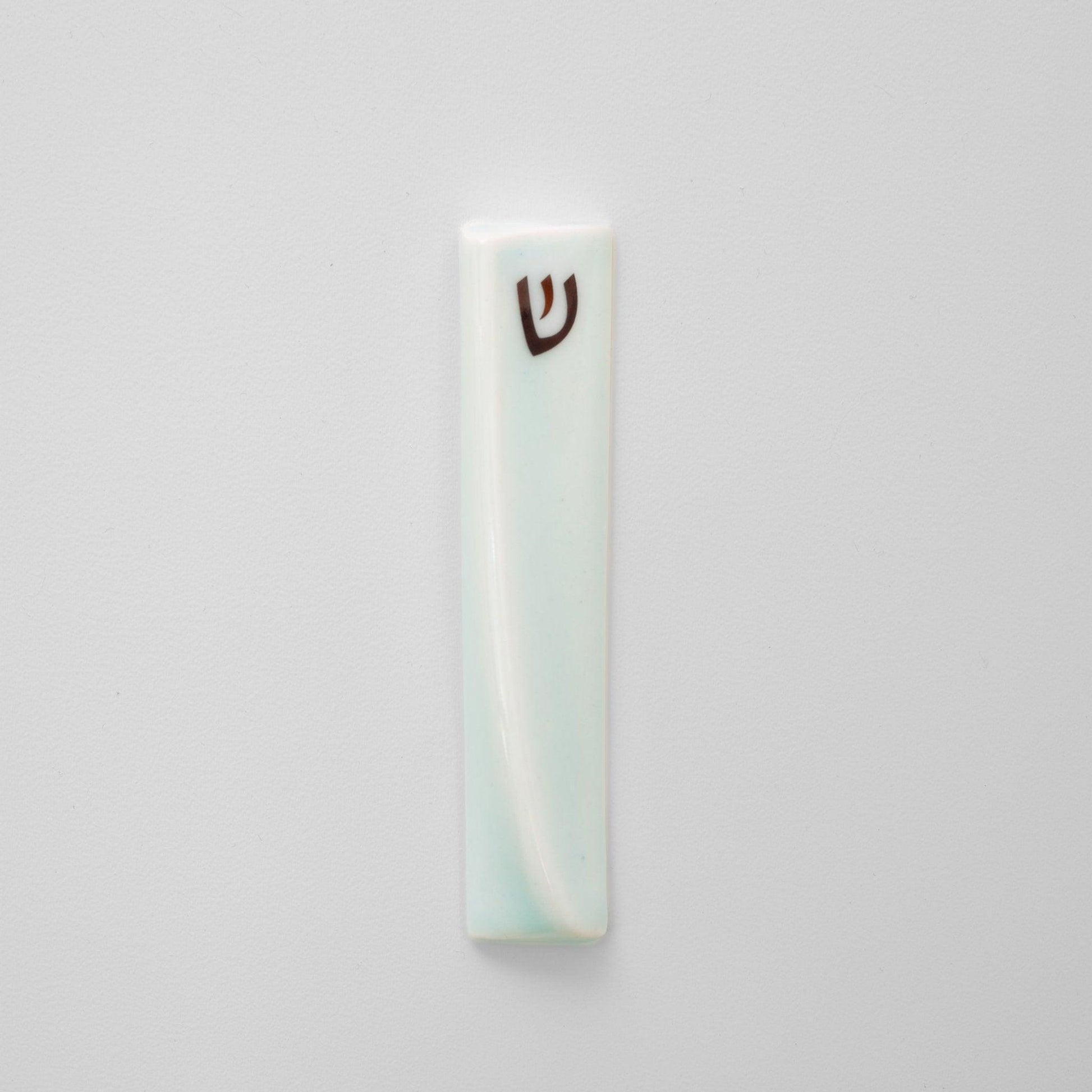 Handcrafted mezuzah with a sleek, modern design, featuring minimalist details and a smooth finish, perfect for adorning doorposts with style and tradition. Available at Green Judaica.